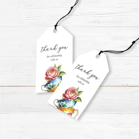 Beautiful Sip and See baby shower favor tags featuring a stack of vintage floral tea cups with a blooming pink peony on top. Designed in a watercolor style, this elegant printed invitation has a minimalist white background with classic script and serif fonts for a timeless look. Ideal for tea-themed baby welcome parties, this invitation is professionally printed on premium cardstock and includes matching envelopes for a polished presentation.