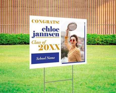 Fun and bold graduation yard sign with a split design featuring a photo on one side and playful, high-contrast text on the other. Includes "Congrats!" message, custom class year, and school name. Printed on durable Coreplast plastic, perfect for outdoor celebrations, driveways, and front yards. blue and gold

