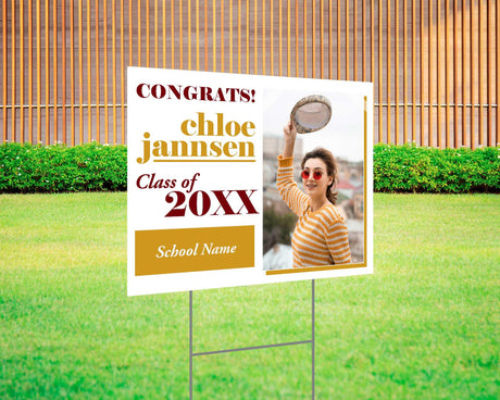 Fun and bold graduation yard sign with a split design featuring a photo on one side and playful, high-contrast text on the other. Includes "Congrats!" message, custom class year, and school name. Printed on durable Coreplast plastic, perfect for outdoor celebrations, driveways, and front yards. burgundy and gold