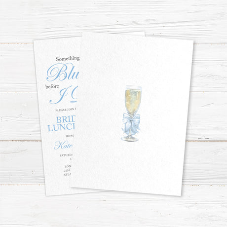 Watercolor bridal luncheon invitation with a champagne glass, light blue satin bow, and elegant script font for a pre-wedding celebration - back