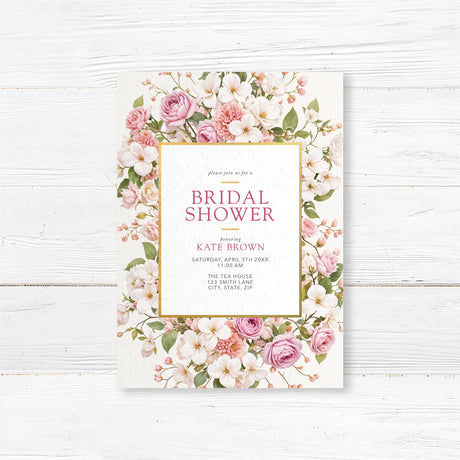 Bridal shower invitation featuring an elegant floral border with pink and white roses and a gold-accented frame. Customizable with the bride’s name and event details, perfect for garden or tea party-themed showers.