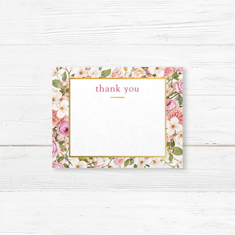 Bridal shower thank you card featuring a delicate floral design with pink and white roses and gold accents. Elegant script with space for a handwritten note or pre-printed message.