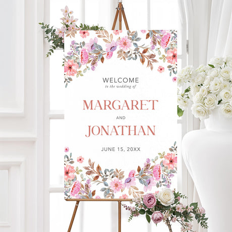 Personalized wedding welcome sign featuring a whimsical wildflower garland frame. Printed on foam board or poster prints, this floral wedding entrance sign is perfect for barn, vineyard, outdoor, or country weddings. Customize with names, wedding date, and greeting message for an elegant and welcoming first impression.