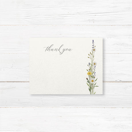 Bridal shower thank you card featuring delicate wildflowers and elegant script typography. Elegant and minimalist design with space for a handwritten note or pre-printed message.