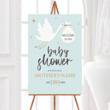 A stork baby shower welcome sign featuring a stork carrying a bundle on a blue background. The design uses simple text and soft colors.