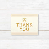 Wedding thank you card with elegant gold serif fonts, cream background, and neutral stripe accents, part of a monogrammed gold wedding stationery suite.