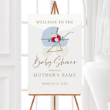 A stroller baby shower welcome sign featuring a blue vintage baby stroller with floral accents. The design has soft colors and elegant typography.