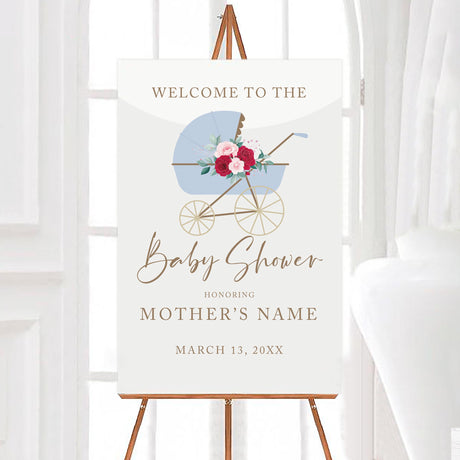 A stroller baby shower welcome sign featuring a blue vintage baby stroller with floral accents. The design has soft colors and elegant typography.