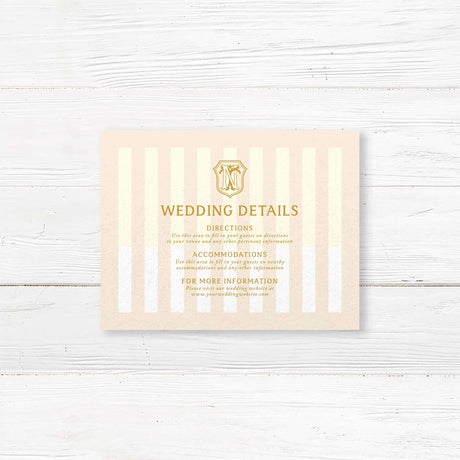 Cream and gold wedding detail card with vertical stripes and serif text