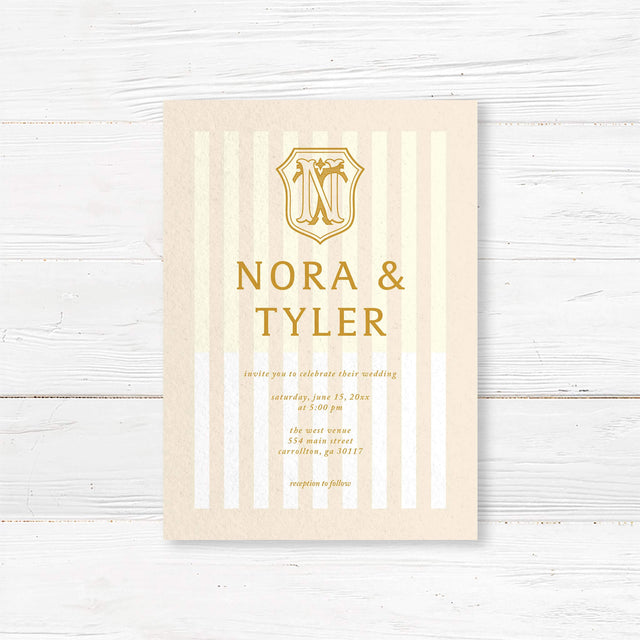 Cream and gold wedding invitation with vertical stripes and vintage-style crest monogram