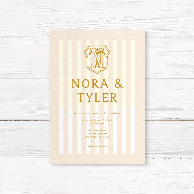 Cream and gold wedding invitation with vertical stripes and vintage-style crest monogram