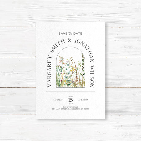 Nature-inspired save the date card with hand-painted wildflowers and a modern arch design. Customizable with names, wedding date, and location. Printed on premium cardstock with optional envelopes. Ideal for rustic, garden, and outdoor weddings, ensuring guests mark their calendars in style.