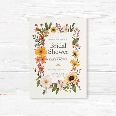 Bridal shower invitation featuring vibrant summer wildflowers in yellow, orange, and blush, printed on premium cardstock for a rustic floral theme.