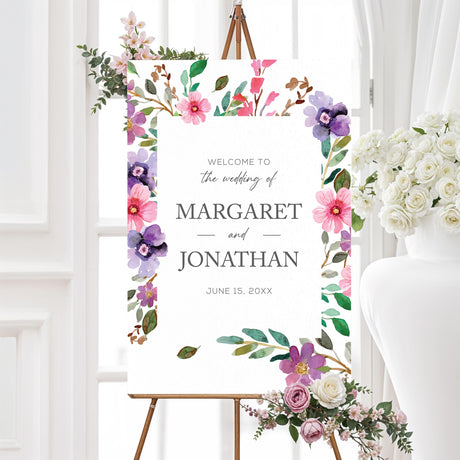 Romantic wedding welcome sign with soft watercolor florals in pink, purple, and green hues. Printed on durable foam core or poster board for a stunning entrance display at garden or outdoor weddings.