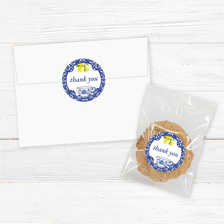 Baby shower favor sticker featuring blue floral tea cup and lemons, perfect for sealing envelopes, favor bags, and gifts.