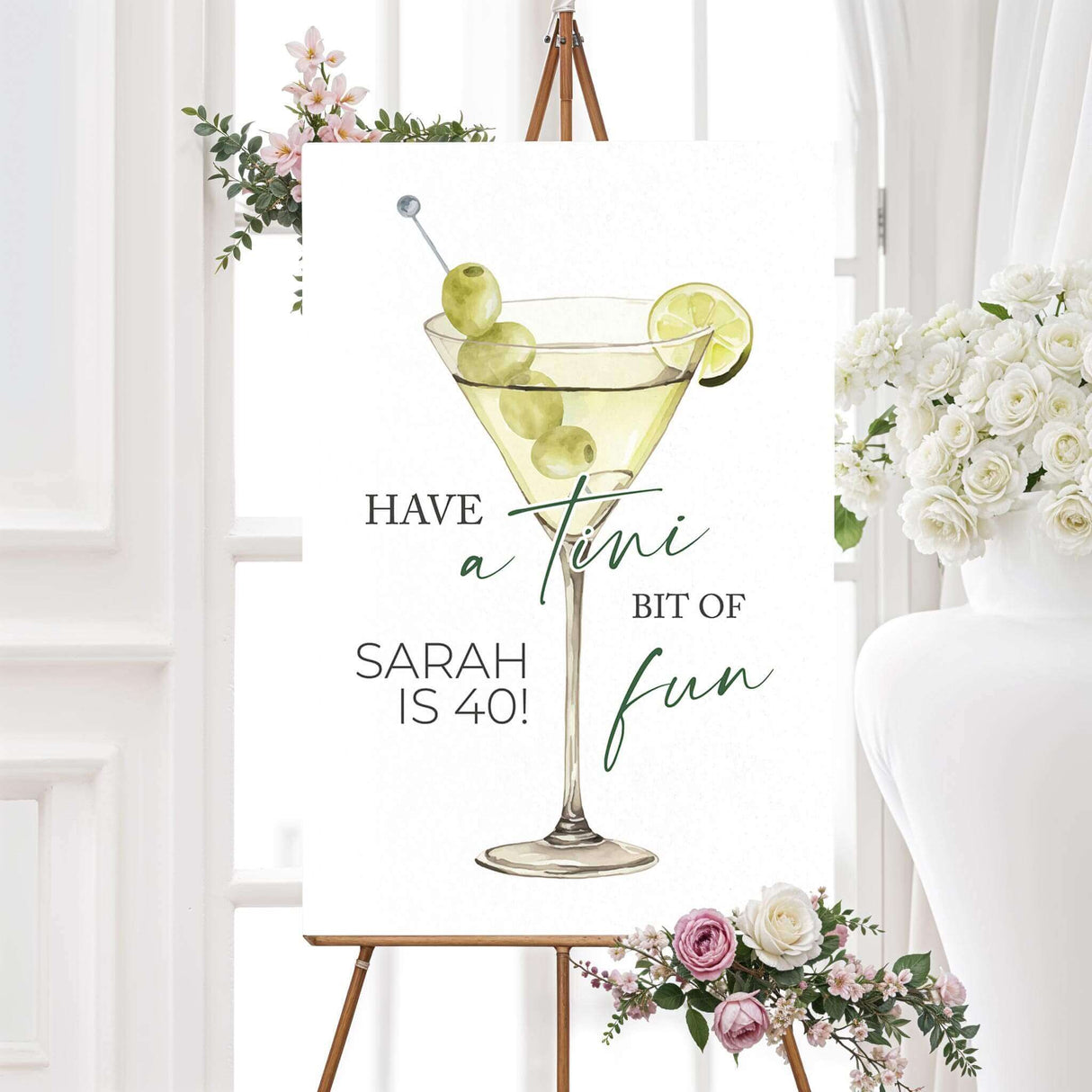 Birthday welcome sign with a watercolor martini glass, green olives, lime, and playful serif and script fonts. Coordinates with a cocktail-themed birthday celebration.