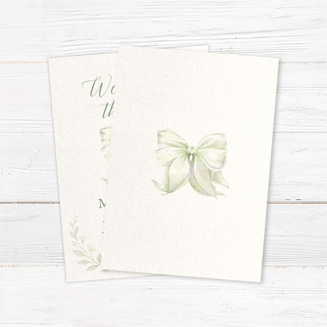 “Tying the Knot” wedding invitation with hand-painted bow and floral accents, professionally printed on textured cardstock - back