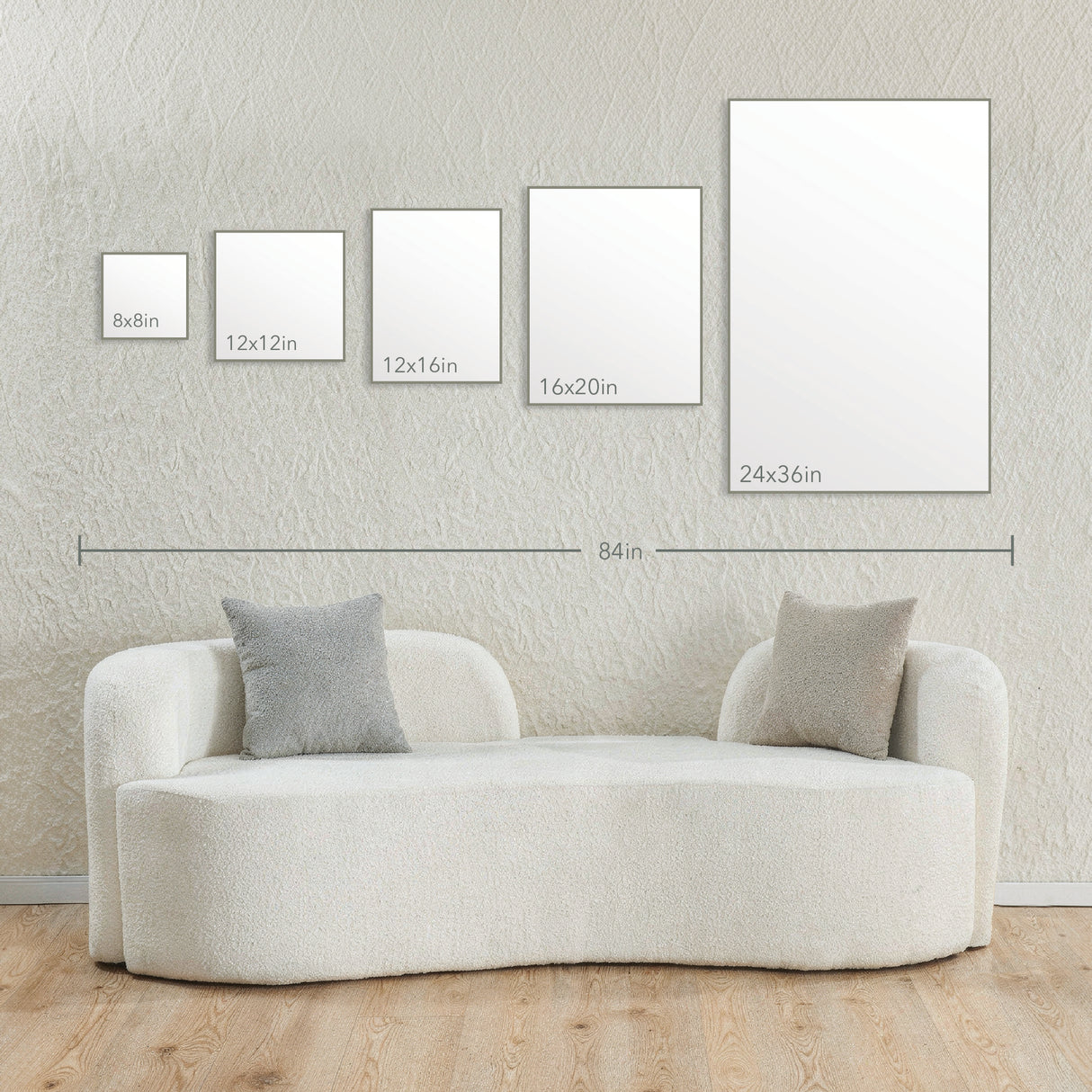 Image of various canvas sizes displayed on a wall above a modern sofa, illustrating dimensions for Upload Your Print Ready Art Canvas art placement.