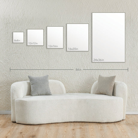 Image of various canvas sizes displayed on a wall above a modern sofa, illustrating dimensions for Upload Your Print Ready Art Canvas art placement.