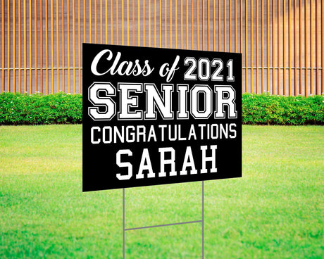 Graduation yard sign featuring bold varsity-style SENIOR lettering, custom class year, and congratulations message. Printed on durable Coreplast plastic, available in custom colors and single or double-sided print, perfect for high school and college graduates. black