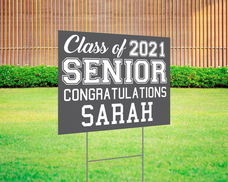 Graduation yard sign featuring bold varsity-style SENIOR lettering, custom class year, and congratulations message. Printed on durable Coreplast plastic, available in custom colors and single or double-sided print, perfect for high school and college graduates. gray