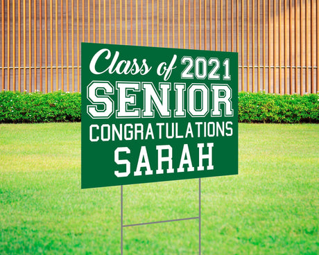 Graduation yard sign featuring bold varsity-style SENIOR lettering, custom class year, and congratulations message. Printed on durable Coreplast plastic, available in custom colors and single or double-sided print, perfect for high school and college graduates. green