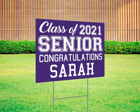 Graduation yard sign featuring bold varsity-style SENIOR lettering, custom class year, and congratulations message. Printed on durable Coreplast plastic, available in custom colors and single or double-sided print, perfect for high school and college graduates. purple