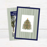 Personalized family Christmas photo card featuring a classic striped border, large family photograph, Merry Christmas greeting, and custom family name. The coordinating back features a decorated Christmas tree framed by matching pinstripes.