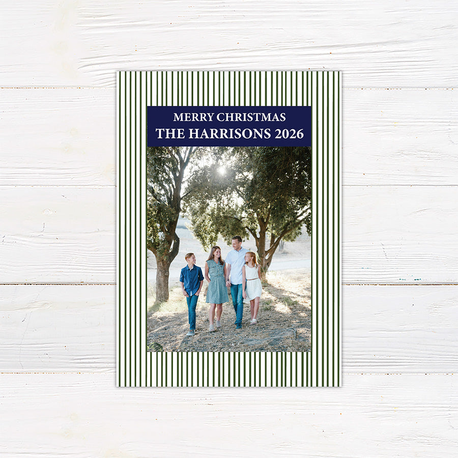 Personalized family Christmas photo card featuring a classic striped border, large family photograph, Merry Christmas greeting, and custom family name. The coordinating back features a decorated Christmas tree framed by matching pinstripes. green