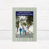 Personalized family Christmas photo card featuring a classic striped border, large family photograph, Merry Christmas greeting, and custom family name. The coordinating back features a decorated Christmas tree framed by matching pinstripes. green