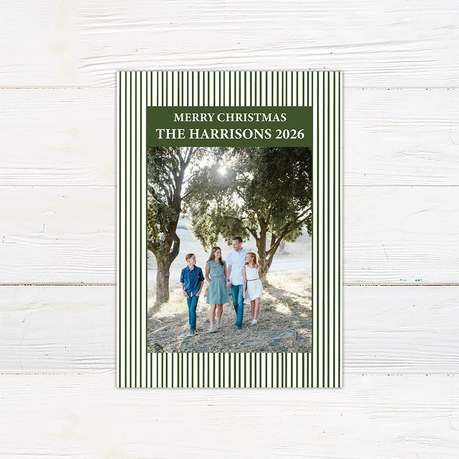 Personalized family Christmas photo card featuring a classic striped border, large family photograph, Merry Christmas greeting, and custom family name. The coordinating back features a decorated Christmas tree framed by matching pinstripes.