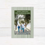 Personalized family Christmas photo card featuring a classic striped border, large family photograph, Merry Christmas greeting, and custom family name. The coordinating back features a decorated Christmas tree framed by matching pinstripes.