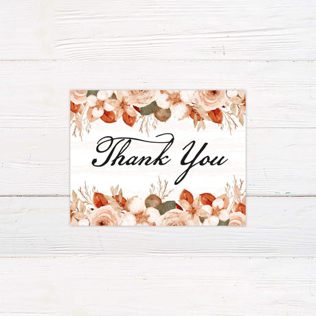 Thank you card with soft rust and beige floral motif and classic script.