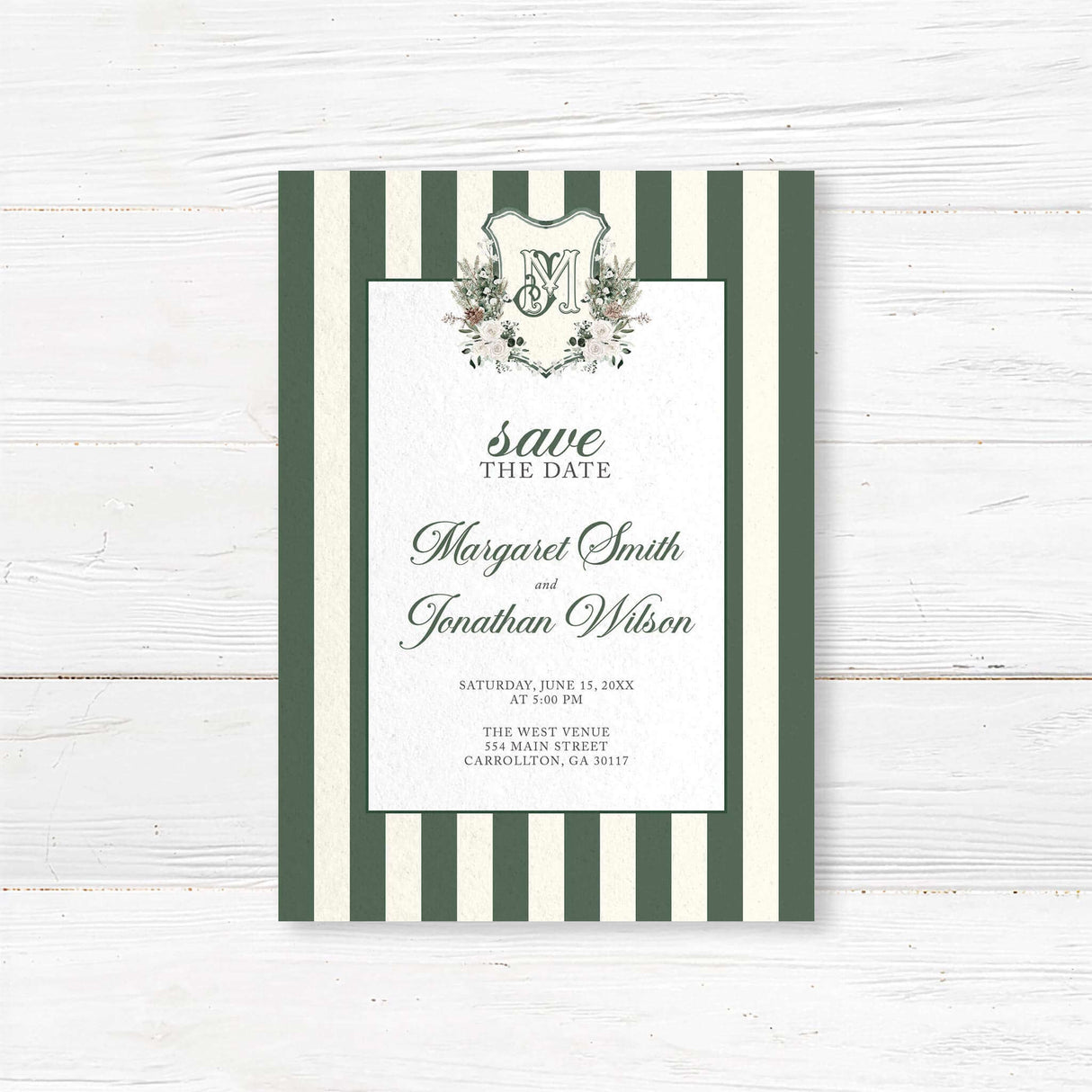 Save the Date card for winter wedding featuring dark green and ivory vertical stripes, centered white panel, floral crest monogram, and romantic script and serif fonts.