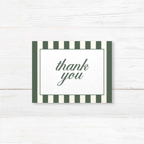 Wedding thank you card with botanical floral crest, vertical green and ivory stripes, and classic fonts for a printed card matching the Winter Crest wedding stationery suite.